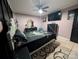 Main bedroom with king bed, dark wood accents, and ceiling fan at 327 Johnson Dairy Rd, Mooresville, NC 28115