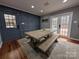 Farmhouse dining table with benches, and access to the backyard at 327 Johnson Dairy Rd, Mooresville, NC 28115