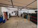 Attached garage with ample storage and workbench at 327 Johnson Dairy Rd, Mooresville, NC 28115