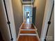 Hardwood stairs and hallway with gray walls at 327 Johnson Dairy Rd, Mooresville, NC 28115