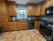 Kitchen with wood cabinets, granite countertops, and stainless steel appliances at 327 Johnson Dairy Rd, Mooresville, NC 28115