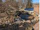 Serene koi pond with bridge and waterfall feature at 327 Johnson Dairy Rd, Mooresville, NC 28115
