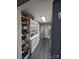 Well-organized pantry with ample shelving and a refrigerator at 327 Johnson Dairy Rd, Mooresville, NC 28115