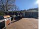 Spacious deck with built-in gas grill and seating area at 327 Johnson Dairy Rd, Mooresville, NC 28115