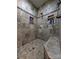Large walk-in shower with tiled walls and built-in shelving at 327 Johnson Dairy Rd, Mooresville, NC 28115