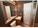 Bathroom features a sink, toilet and mirror at 3463 Rock Creek Dr, Newton, NC 28658