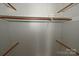 Basic closet with wood shelving and rods at 3463 Rock Creek Dr, Newton, NC 28658