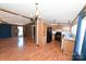 Kitchen with light wood cabinets, black appliances, and laminate floors at 3463 Rock Creek Dr, Newton, NC 28658