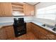 Kitchen with wood cabinets and black appliances at 3463 Rock Creek Dr, Newton, NC 28658