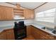 Kitchen with wood cabinets and black appliances at 3463 Rock Creek Dr, Newton, NC 28658