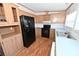 Kitchen with wood cabinets and black appliances at 3463 Rock Creek Dr, Newton, NC 28658