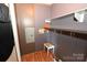 Small laundry room with shelving and stool at 3463 Rock Creek Dr, Newton, NC 28658