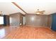 Open living room, laminate wood flooring, ceiling fan at 3463 Rock Creek Dr, Newton, NC 28658