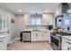 Updated kitchen, featuring white cabinets and new appliances at 3512 Carlyle Dr, Charlotte, NC 28208