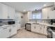 Modern kitchen with white cabinets and a kitchen island at 3512 Carlyle Dr, Charlotte, NC 28208