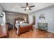 Main bedroom with wood floors and a ceiling fan at 3625 Stonefield Sw St, Concord, NC 28027