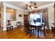 Formal dining room with hardwood floors and large window at 3680 Bermuda Nw Ct, Concord, NC 28027