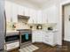 Modern kitchen with stainless steel appliances and white cabinetry at 4071 Wycoff Rd, Sharon, SC 29742