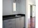 Modern bathroom with a single vanity and a view to another room at 411 E Gary St, Candor, NC 27229