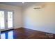 Bright bedroom with double doors leading to the backyard at 411 E Gary St, Candor, NC 27229
