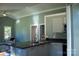 Modern kitchen with stainless steel appliances and dark countertops at 411 E Gary St, Candor, NC 27229