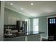 Modern kitchen with stainless steel appliances and dark countertops at 411 E Gary St, Candor, NC 27229