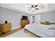 Bedroom with hardwood floors, ceiling fan, and built-in dresser at 5669 Berry Ridge Dr, Harrisburg, NC 28075