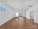 Bright and airy living room with hardwood floors and sliding glass doors at 6864 Good News Dr, Charlotte, NC 28215