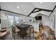 Virtually staged dining area with a modern table and chairs at 709 Grass Dr, Charlotte, NC 28216