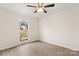 Bright bedroom with wood-look floors and a ceiling fan at 9004 English Saddle Ln, Charlotte, NC 28273