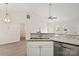 Kitchen with granite countertop, stainless steel dishwasher, and white cabinets at 9004 English Saddle Ln, Charlotte, NC 28273