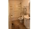 Bathroom with tub, toilet, and shelving unit at 9697 Us 52 N Hwy, Wadesboro, NC 28170