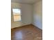 Simple bedroom with hardwood floors and a window at 9697 Us 52 N Hwy, Wadesboro, NC 28170
