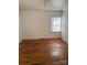 Hardwood floors and a window in this simple bedroom at 9697 Us 52 N Hwy, Wadesboro, NC 28170