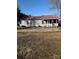 Ranch style home with red metal roof and spacious yard at 9697 Us 52 N Hwy, Wadesboro, NC 28170