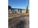 Two gray storage sheds sit on a gravel driveway at 9697 Us 52 N Hwy, Wadesboro, NC 28170