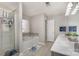 Bathroom featuring a double vanity, separate shower, and a soaking tub with tile accents at 100 Melrose Ct, Fort Mill, SC 29715