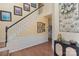 Inviting foyer with hardwood floors, staircase, and decorative accents at 100 Melrose Ct, Fort Mill, SC 29715