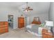 Bright main bedroom with vaulted ceilings and ensuite access, featuring coordinated wood furnishings at 100 Melrose Ct, Fort Mill, SC 29715