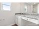 Bathroom boasts granite countertop and white cabinets at 103 Adams Tree Way, Troutman, NC 28166