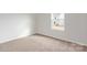 Bright bedroom with neutral walls and carpet at 103 Adams Tree Way, Troutman, NC 28166
