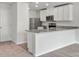 Kitchen with white cabinets, granite countertops, and stainless steel appliances at 103 Adams Tree Way, Troutman, NC 28166