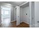 Hallway with doors to bedroom and laundry closet at 1106 Stanton Dr, Shelby, NC 28150