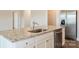 Kitchen island with granite countertop and stainless steel sink at 111 Adams Tree Way, Troutman, NC 28166
