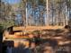 Landscaped backyard with tiered retaining walls at 119 Creek View Rd, Mooresville, NC 28117