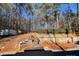 Stone retaining wall and steps leading up to wooded area at 119 Creek View Rd, Mooresville, NC 28117