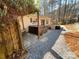 Hot tub on patio, with gravel pathway and wooded backdrop at 119 Creek View Rd, Mooresville, NC 28117