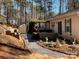 Backyard with gravel pathway, hot tub, and storage shed at 119 Creek View Rd, Mooresville, NC 28117