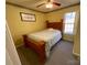 Bedroom with wood bed frame and window at 119 Creek View Rd, Mooresville, NC 28117