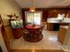 Bright dining area with a round table and access to the backyard at 119 Creek View Rd, Mooresville, NC 28117